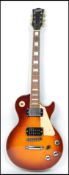 A Classic six string vintage electric guitar having a shaped body with burnt effect body.