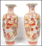 A pair of Chinese early 20th century Kutani floor vases of large form with trumpet tops and baluster