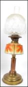 A 1930's Art Deco  brass and glass oil lamp having sunburst decorated glass reservoir over brass