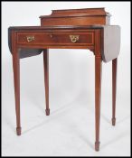 An Edwardian mahogany ladies bonheur de jour - writing table desk. Raised on mahogany square
