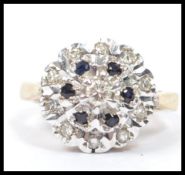A hallmarked 18ct gold ladies diamond cluster ring having layered illusion set diamonds with