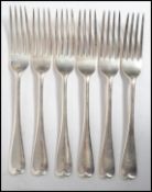A set of 6 solid silver hallmarked table dinner forks bearing monograms to the handles. Hallmarked