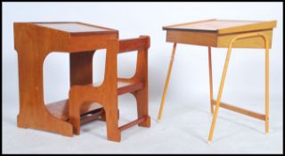 A vintage 20th century childs work desk and matching chair together with another childs work desk