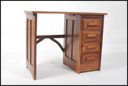 A 1920's Art Deco Air Ministry / Industrial style childs single pedestal knee-hole oak writing desk.