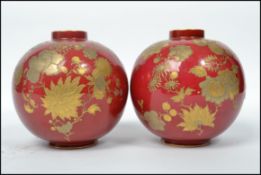 A pair of 19th century Victorian Royal Crown Derby red and gold hand painted ball vases, each with