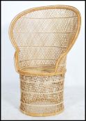 A vintage 20th century / late 1970's retro wicker peacock armchair chair. Large open back chair with