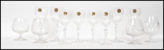A group of 20th century crystal glasses to include large and small wine glasses, sherry glasses