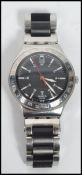 A vintage gentleman's Swatch Swiss Irony watch set on a stainless steel bracelet, the black dial
