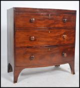 A 19th century bow front mahogany bachelors chest of drawers being raised on french kick legs with