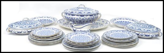 A 19th century Victorian blue and white dinner service by Booths in the Indian Ornament pattern