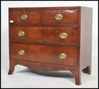 A 19th Georgian mahogany crossbanded chest of drawers having french kick legs with 2 short drawers