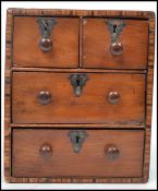 A 19th century Victorian tunbridge inlay mahogany apprentice piece two over two chest of drawers