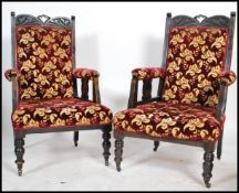 A pair of Victorian mahogany library armchairs having good chenille upholstered fabric raised on