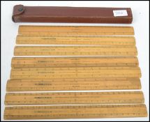 An early 20th century leather cased wooden ruler set by J Halden & Co Ltd of Birmingham Glasgow
