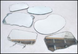 A large collection of early 20th century circa 1930's  art deco wall hanging mirrors having bevelled