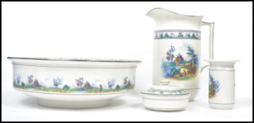 A 20th century Edwardian Staffordshire wash bowl and jug with matching soap dish, transfer design