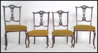 A set of Edwardian mahogany salon suite chairs to include 2 dining chairs and 2 low music /