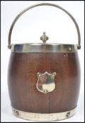 A vintage 20th century silver plated biscuit barrel in the form of a coopered barrel having white