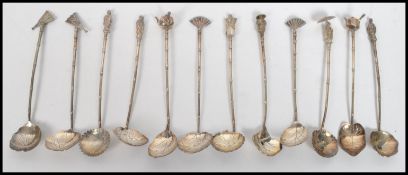 A set of twelve vintage 20th century Japanese silver hallmarked coffee / tea spoons, the bowls in