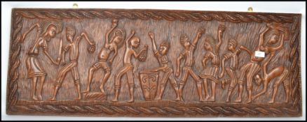 A large 20th century tribal African carved panel of long rectangular form having a gadrooned