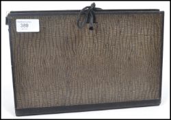 An early 20th century industrial Shriften Ordner expanding file having German lettering with