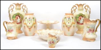 A pair of Staffordshire twin handled vases having decorative scenic panels together with a pair