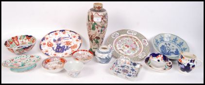 A collection of Chinese and oriental ceramics to include a famille rose salt glaze vase, square