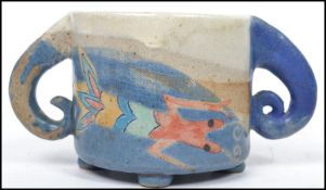 An unusual mid 20th century studio pottery twin handled loving cup depicting a stylised lobster
