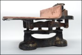 A good early 20th century military issue / G.P.O set of cast iron and copper weighing scales. The