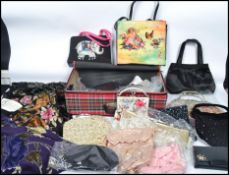 A collection of both vintage and contemporary ladies evening bags, many with needlepoint detailing