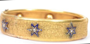 A 19th century 15ct gold and diamond chatelaine bangle bracelet decorated with a etched swirls