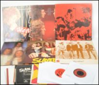 A collection of 7 vintage Slade vinyl LP's records to include Play It Loud, Slayed, Sladest, Slade