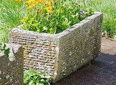 An antique 19th century deep natural stone trough  of rectangular shaped form being hewn hand carved