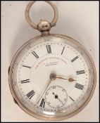 A silver cased open face pocket watch with notation The Express English Lever by J G Greaves,