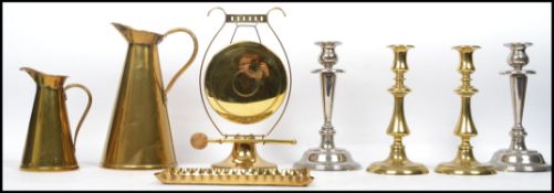 A collection of vintage brass ware dating from the 19th century to include a pair of candle