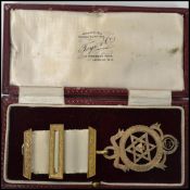 A hallmarked silver early 20th century Masonic fob medal mounted an gilt metal adorned ribbon,
