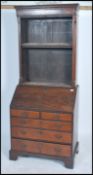 An 18th century Georgian mahogany bureau bookcase. Raised on bracket supports having short and