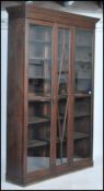 A tall 19th century mahogany library bookcase, the moulded cornice above a pair of full length