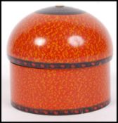 A 20th century Indian painted turned wood set of dome topped boxes having a bead finials atop.