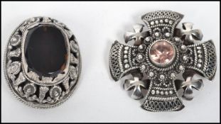 Two vintage silver white metal brooches. One in the form of a Celtic cross with a mounted inset