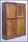 A good 19th century painted scrumble finish Industrial Victorian Estate Cupboard having four sliding
