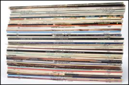A collection of vinyl long play LP records featuring various artists to include Simon and Garfunkel,