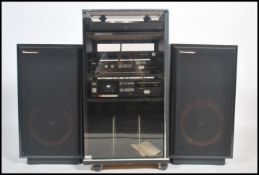 A Hitachi music system to include a record turntable H-12 , amp , cassette deck  and tuner inside