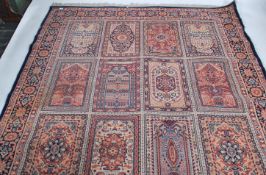 A vintage 20th century Persian style floor rug / carpet having blue ground with diamond and