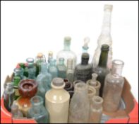 A collection of vintage glass bottles dating from the 19th century to include Victorian examples,
