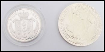 A 1991 Nieu 10 dollar silver proof commemorative coin dating to 1992 to commemorate the Olympics
