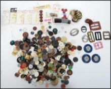 A collection of vintage and retro 20th century buttons to include military examples, some carded etc