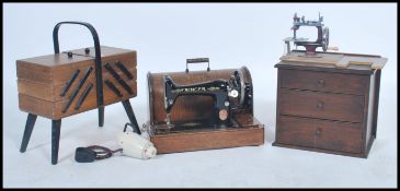 A vintage mid century sewing box with contents together with a chest of drawers with contents and