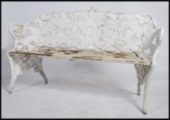 A Victorian style painted cast metal  fern and blackberry garden bench in the manner of