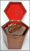 A 19th century Victorian rosewood squeeze box having a gilt tooled leather squeeze with ivory